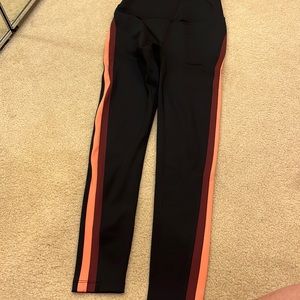 Split 59 leggings black with maroon and peach piping on side. Worn once